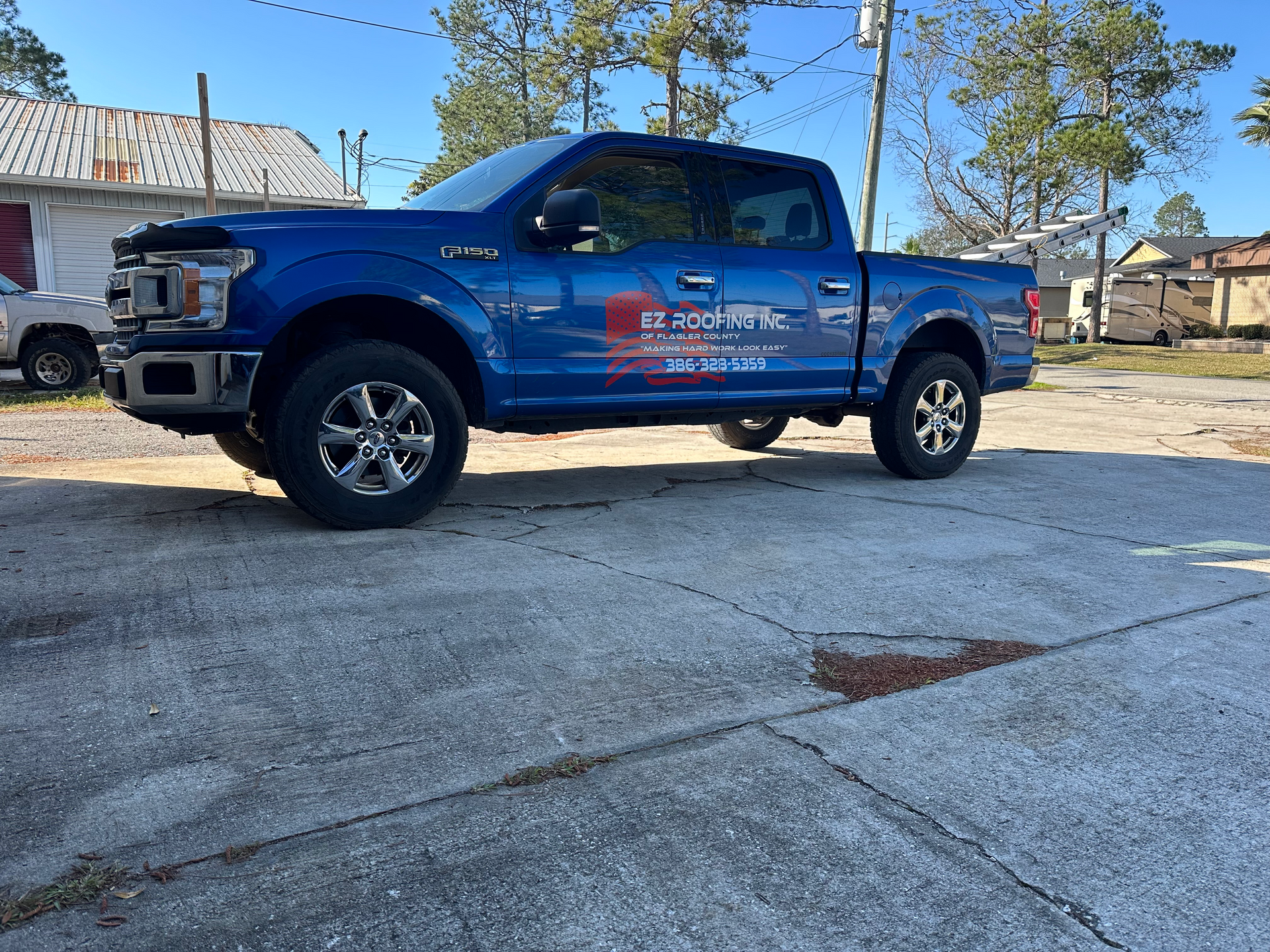 EZ Roofing of Flagler County branded work truck