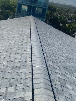 Close-up of a freshly installed shingle ridge cap